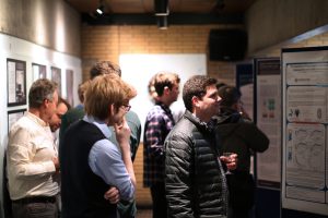 Academics reading research posters